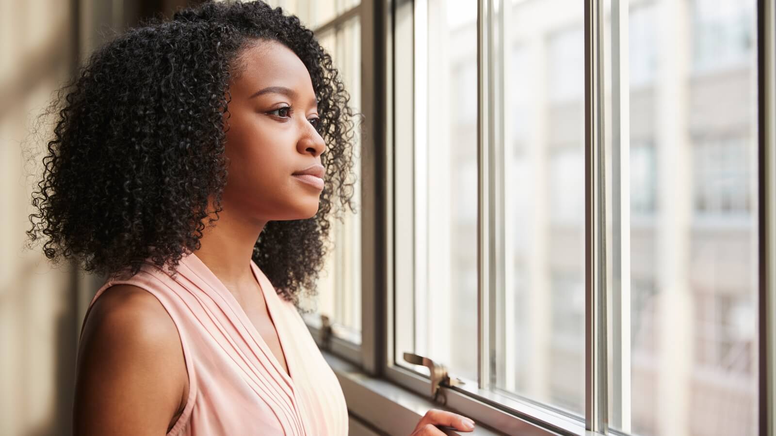 woman looking out of window