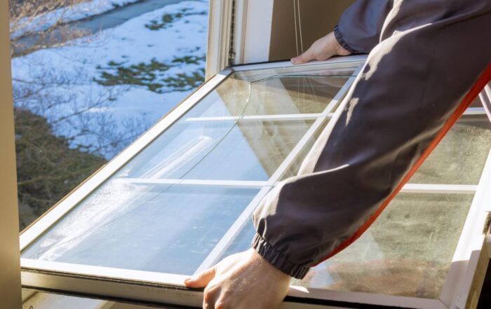 a person holding a window