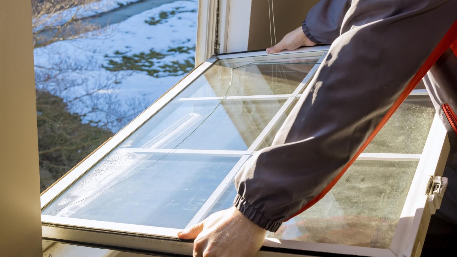 a person holding a window