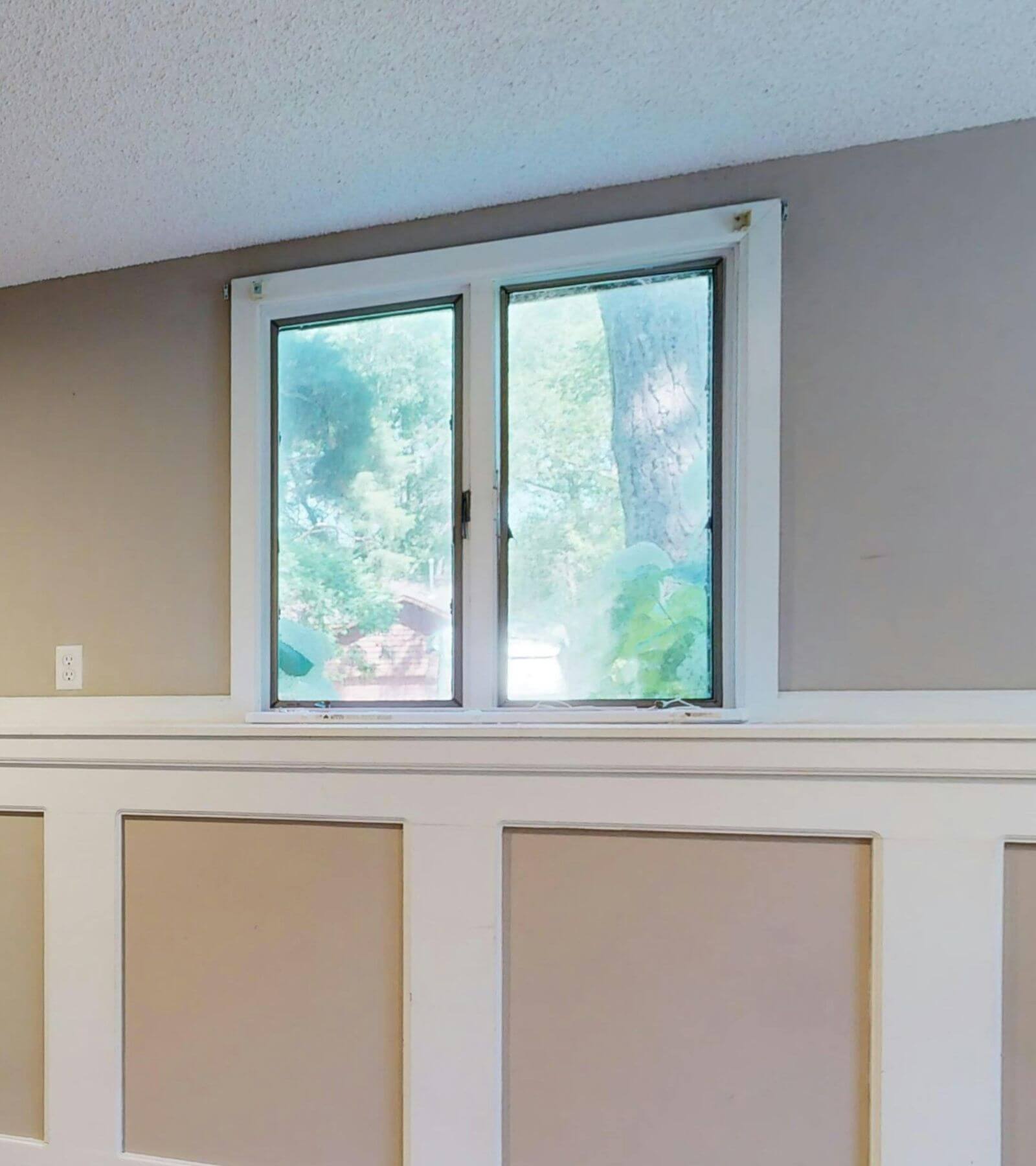 egress window with white trim in basement