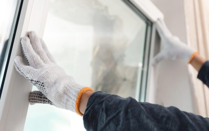person replacing window