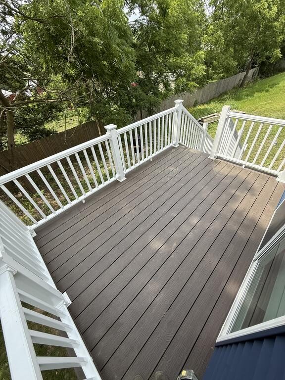 Deck page close up of deck with white fencing